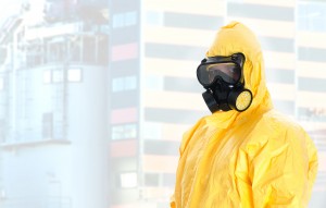 Worker in protective chemical suit. Space for your text.