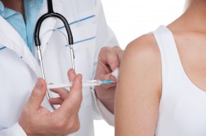 Person receiving a vaccine. Close up of a vaccination protection