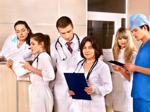 Group doctors at reception in hospital.