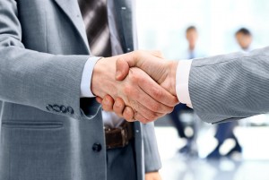 Close up of businessmen shaking hands